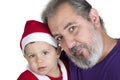 Small kid in Santa Claus clothes with his Ã¢â¬â¹Ã¢â¬â¹grandfather Royalty Free Stock Photo